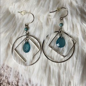 Silver earrings with blue stone detail